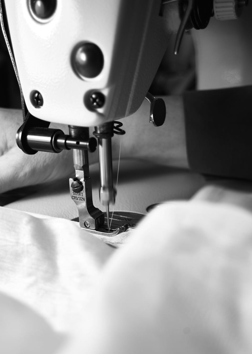 Close detail of stitching work at a sewing machine